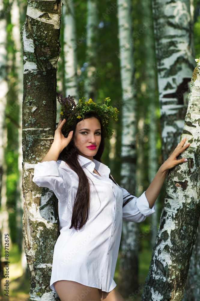 beautiful woman in shirt standing near the birches beautiful woman in shirt standing near the birches