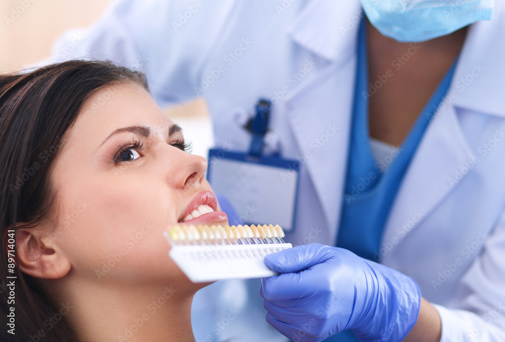 Woman dentist working at her patients teeth Woman dentist working at her patients teeth