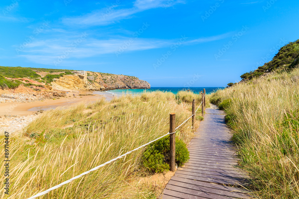 Walkway to beautiful Zavial beach along grassland, Portugal Walkway to beautiful Zavial beach along grassland, Portugal