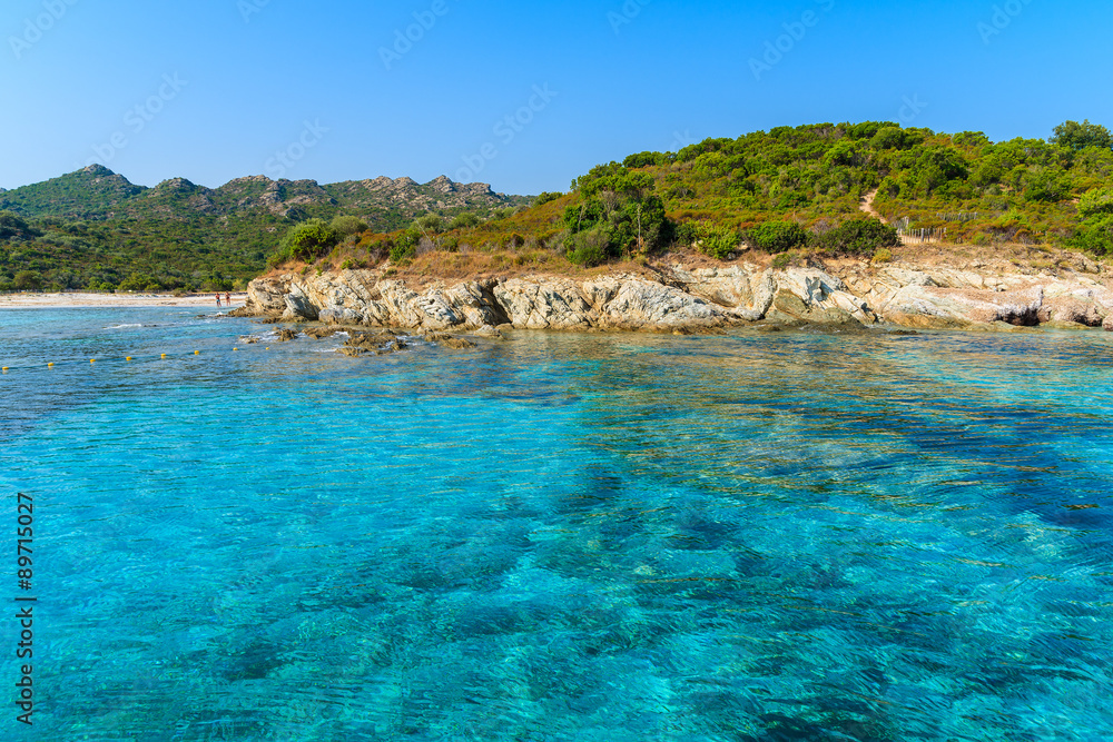 Crystal clear sea water in secluded bay near Bonifacio town, Corsica island, France