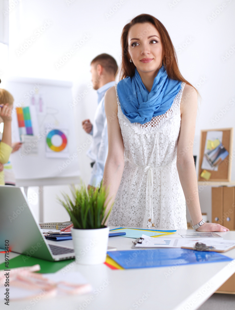 Portrait of attractive female designer in office Portrait of attractive female designer in office