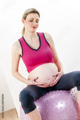 portrait of pregnant woman doing exercises