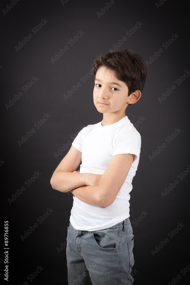 Handsome boy doing different expressions in different sets of clothes: arms crossed Handsome boy doing different expressions in different sets of clothes: arms crossed
