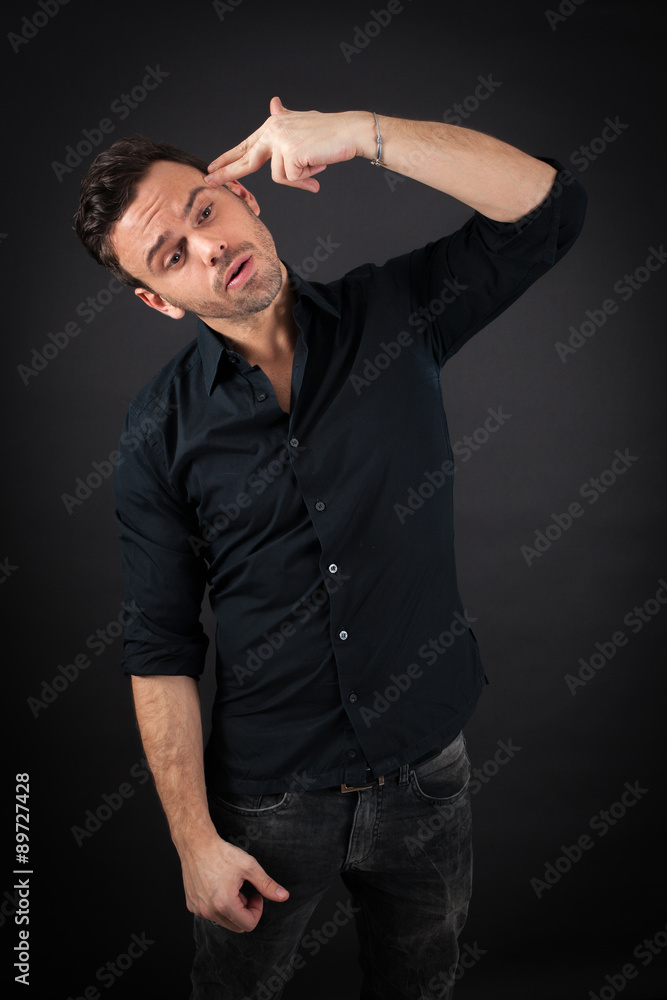 Naklejka premium handsome man doing different expressions in different sets of clothes: suicide