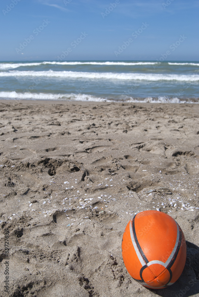 Obraz premium rugby ball on the beach