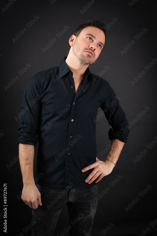 Naklejka premium handsome man doing different expressions in different sets of clothes: tired