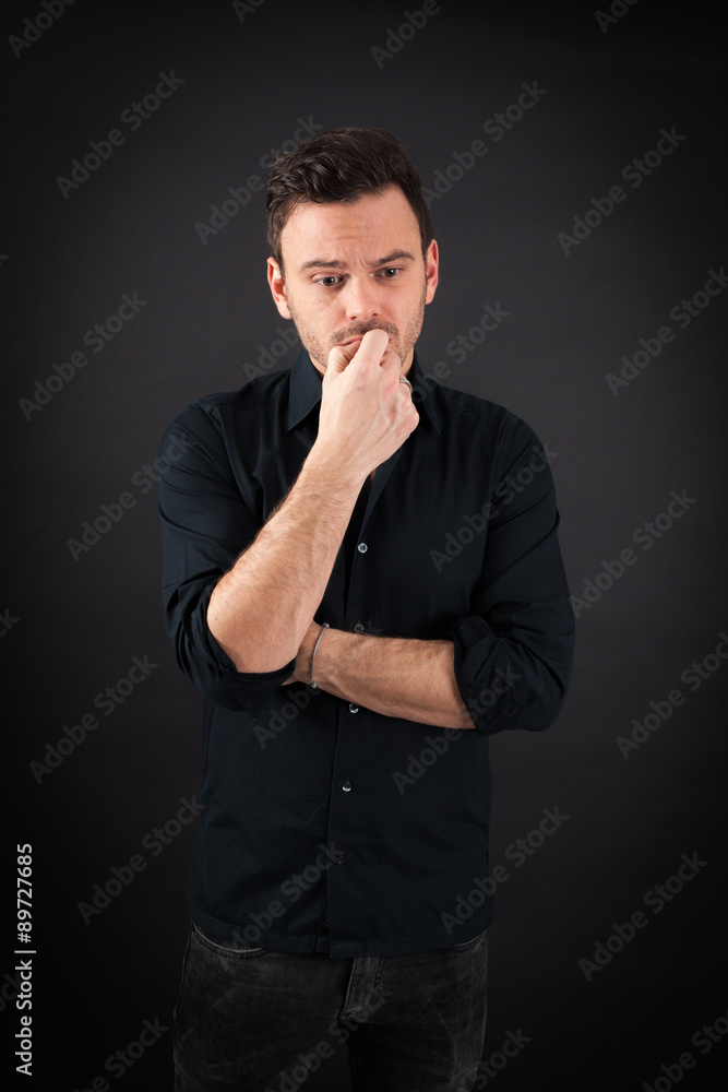 handsome man doing different expressions in different sets of clothes: worried handsome man doing different expressions in different sets of clothes: worried