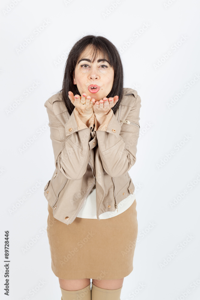 Beautiful woman doing different expressions in different sets of clothes: kiss Beautiful woman doing different expressions in different sets of clothes: kiss