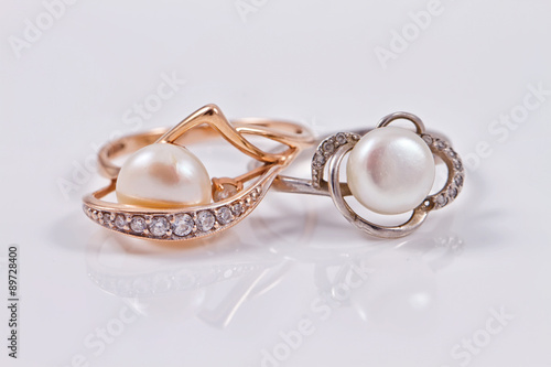 Elegant gold and silver ring with pearls