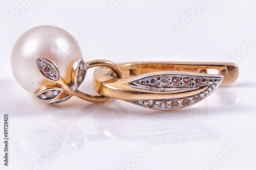 Beautiful gold earring with pearl