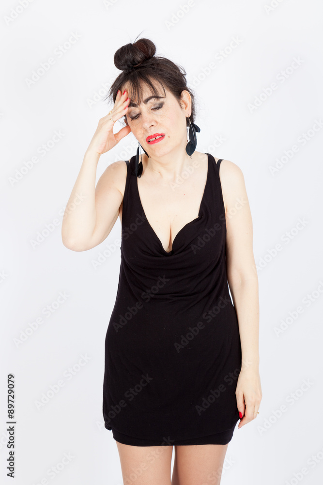 Beautiful woman doing different expressions in different sets of clothes: headache Beautiful woman doing different expressions in different sets of clothes: headache