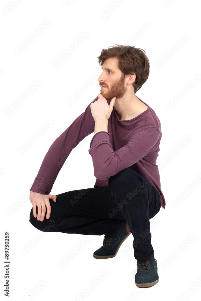 Handsome man doing different expressions in different sets of clothes: kneeling Handsome man doing different expressions in different sets of clothes: kneeling