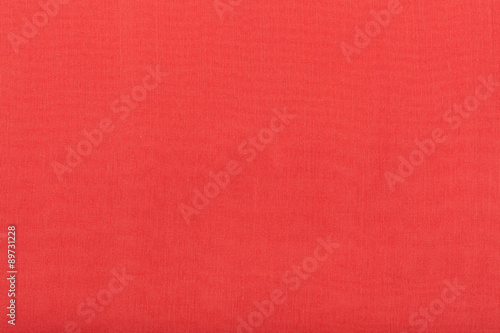 background from red batiste fabric