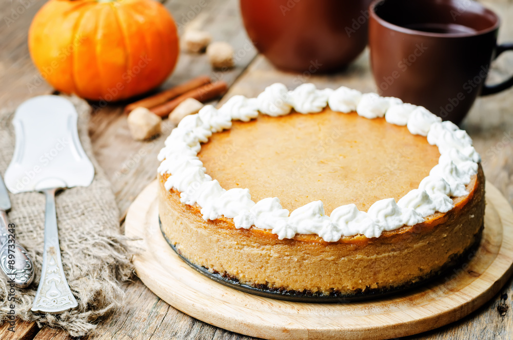 pumpkin cheesecake decorated with whipped cream pumpkin cheesecake decorated with whipped cream