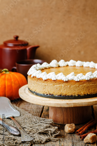 pumpkin cheesecake decorated with whipped cream © nata_vkusidey