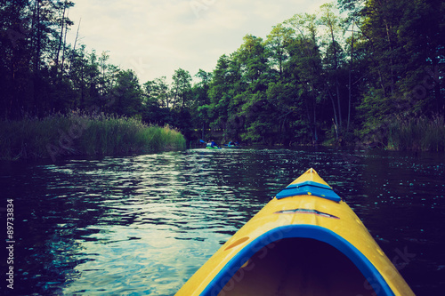 Vintage photo of kayaking by Krutynia river in Poland photo