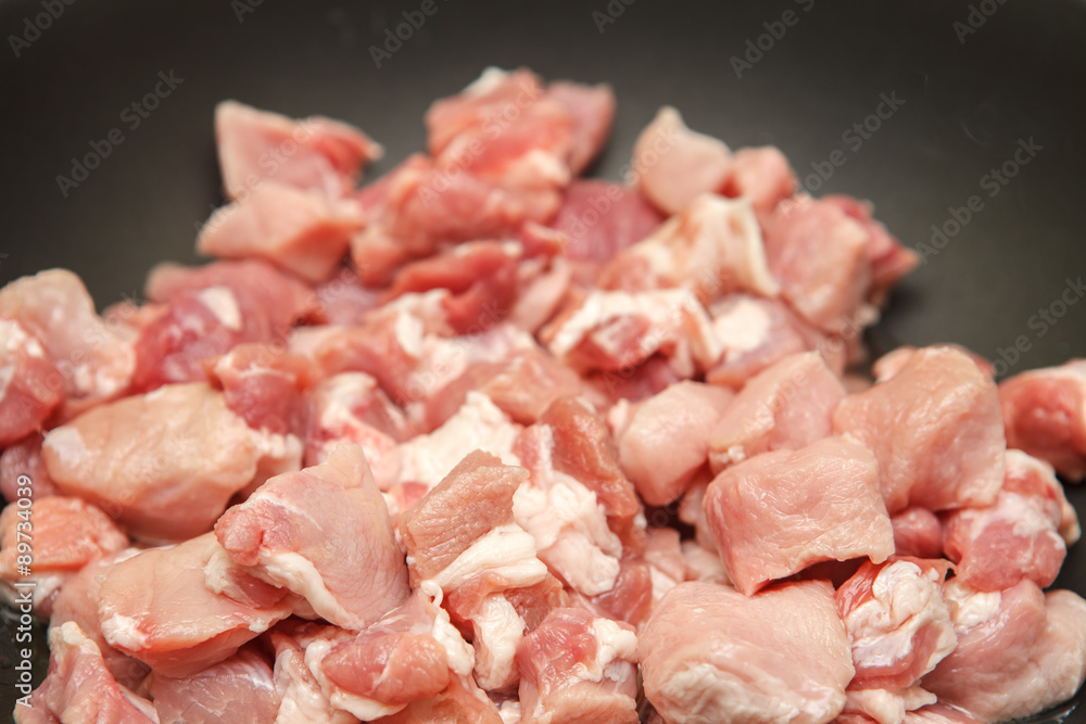 meat cut into pieces fried in a pan meat cut into pieces fried in a pan