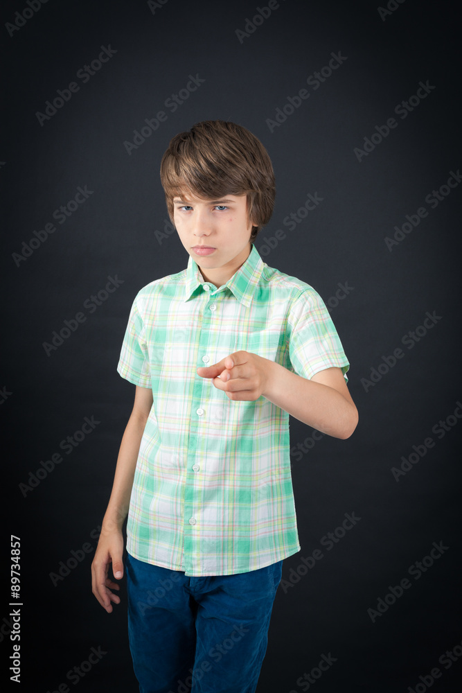 Handsome boy doing different expressions in different sets of clothes: gun sign Handsome boy doing different expressions in different sets of clothes: gun sign