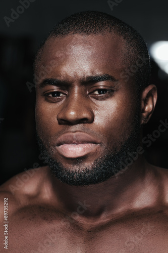 Weight training African bodybuilder portrait
