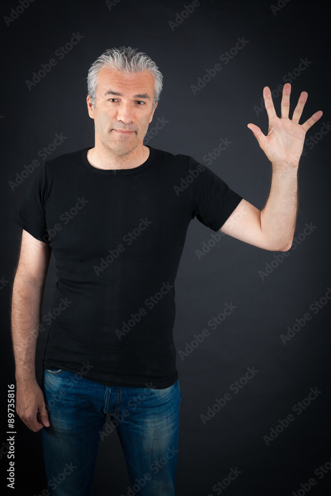 Naklejka premium Handsome man doing different expressions in different sets of clothes: waving