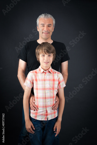 Handsome family doing different expressions in different sets of clothes: posing