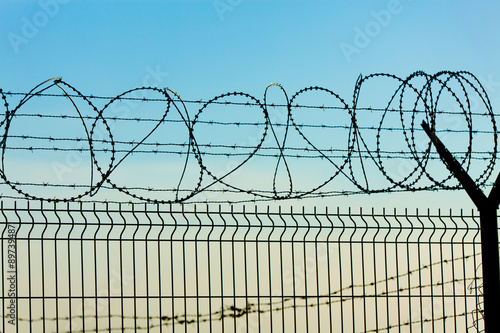 Metal Fence with Barbed Wire