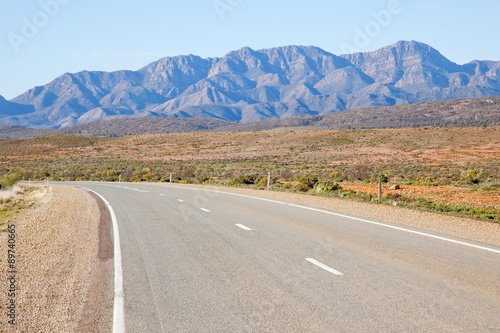 Highway with the Flinders Ranges in the background. South Australia.