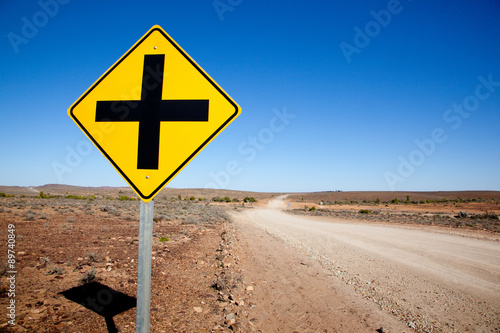 Cross road sign outback Australia.