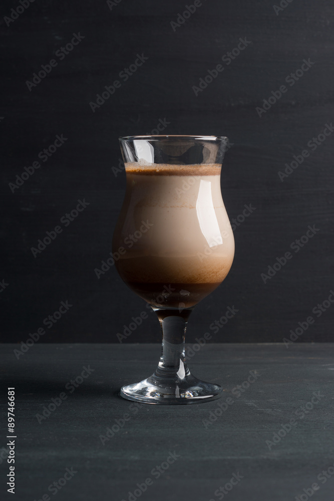 Glass of chocolate milkshake on the table Glass of chocolate milkshake on the table