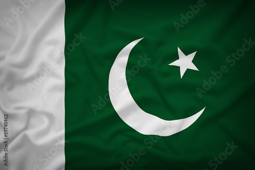 Pakistan flag on the fabric texture background,Vintage style