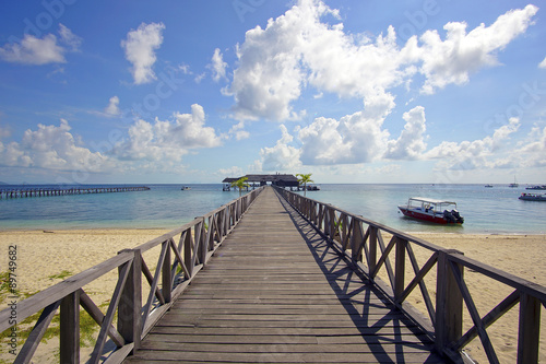 endless jetty to the horizon  view to a turquoise sea and blue s