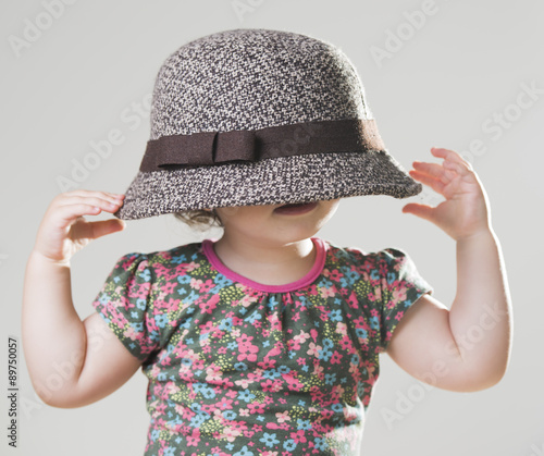 cute baby girl with an oversized hat