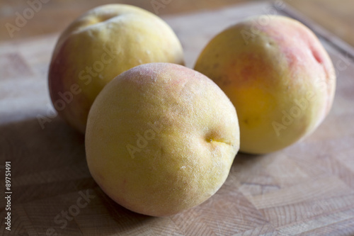  peaches on wood background