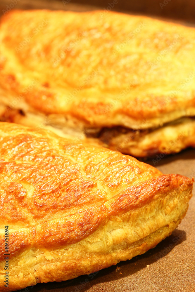 Cornish pasties.
Freshly baked Cornish pasties on a baking tray. Cornish pasties.
Freshly baked Cornish pasties on a baking tray.
