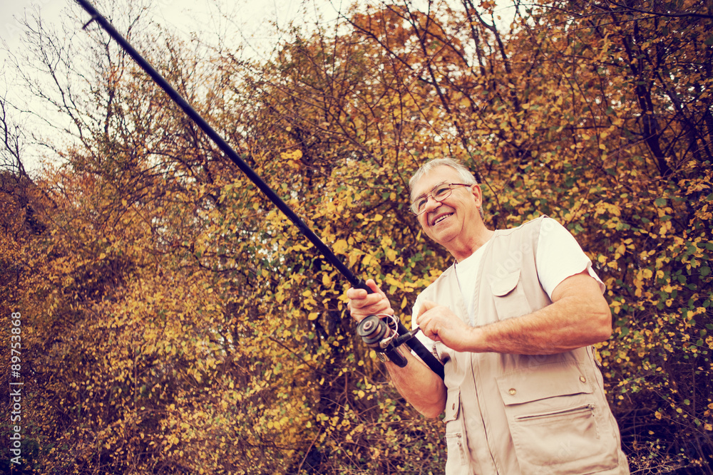 Happy senior man fishing Happy senior man fishing