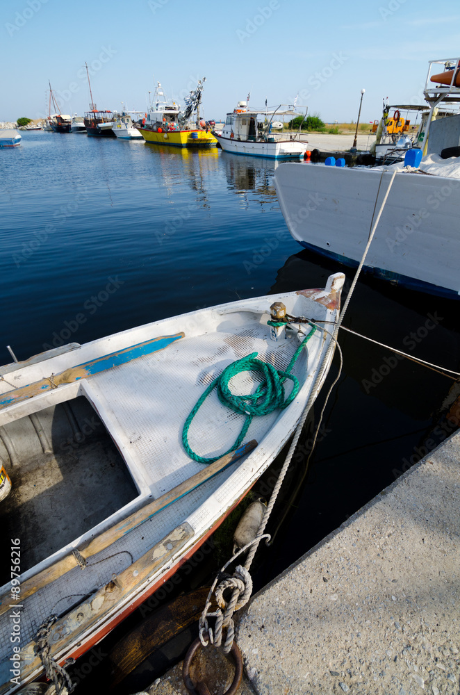 Fisherman boats standing in the port on sunny summer day