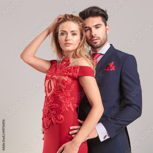Elegant man holding his wife