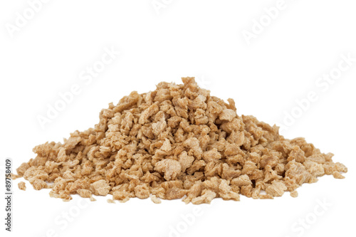 Heap of textured soy protein granules isolated on white background.