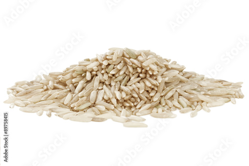 Heap of wholegrain basmati rice isolated on white background. photo