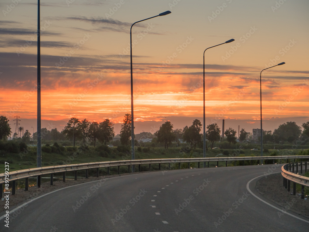 magistral road to beautiful sunset at spring