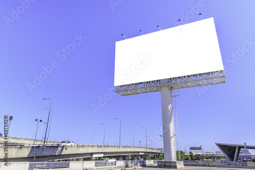 Blank billboard against blue sky for advertisement.