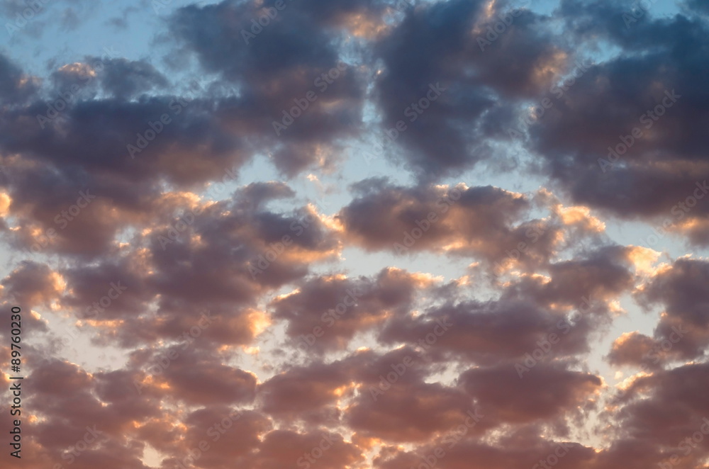cumulus clouds at sunset