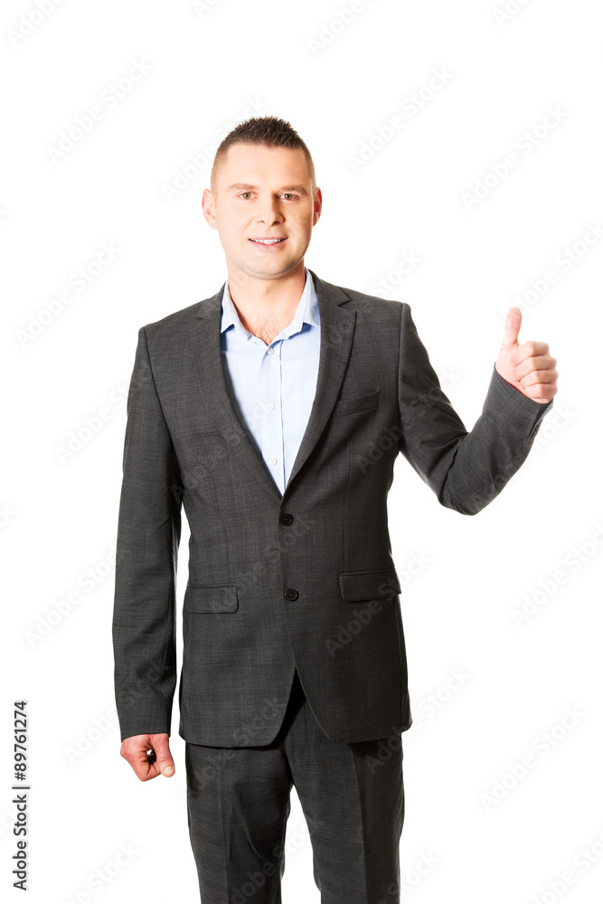 Young businessman gesturing ok sign Young businessman gesturing ok sign
