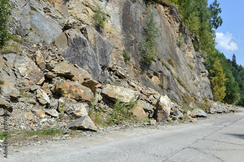 фотографія Rockfall in Carpathians where the road is covered with stones