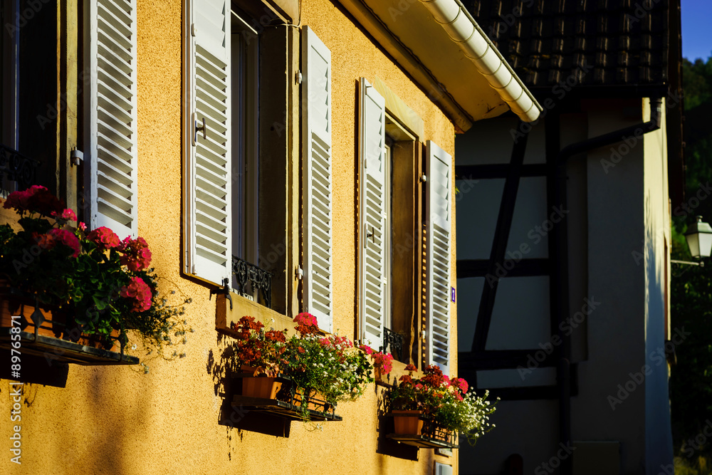 Street view of old windows with shutters, Andlau, France