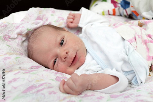 Portrait of smiling newborn baby