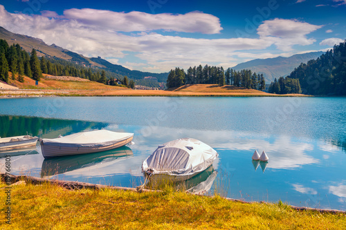 Boat dock on the lake Champfer lake in Swiss Alps. photo