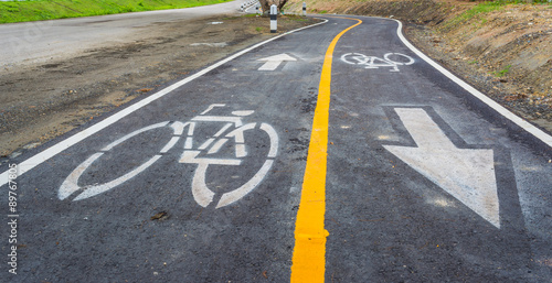 asphalt road and bike lane with sign © coffmancmu
