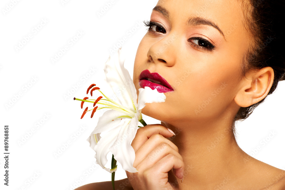 Fototapeta premium Beauty face of woman with lily flower. 