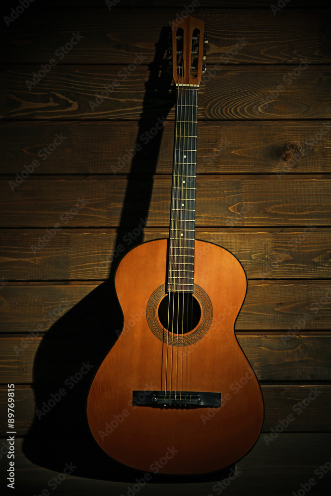Fototapeta premium Classical guitar on wooden background